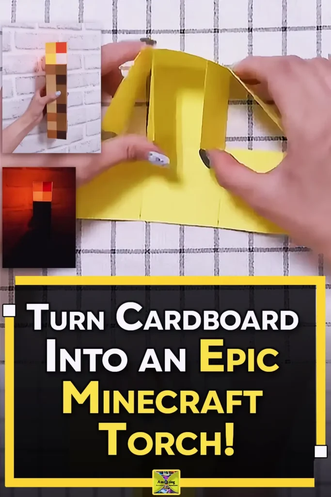 A handmade Minecraft torch made from cardboard and colored paper squares, with a pixelated brown handle and orange-yellow flame top.