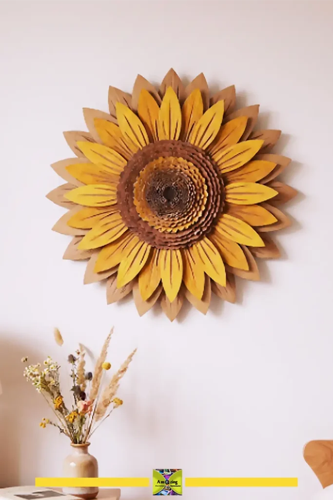 Layered cardboard summer flower wall art shaped like a sunflower in warm yellow and brown tones