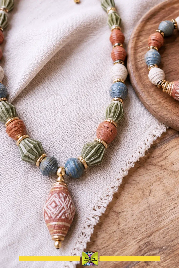 Handmade beads and pendants formed from recycled egg carton paper pulp