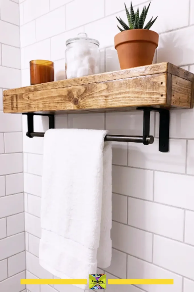 Pallet bathroom shelf with an integrated towel bar and rolled towels