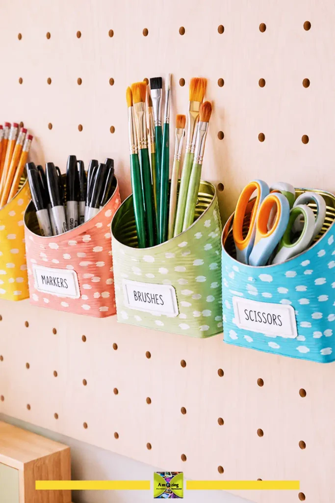 Tin can supply cups mounted on a pegboard wall for vertical storage