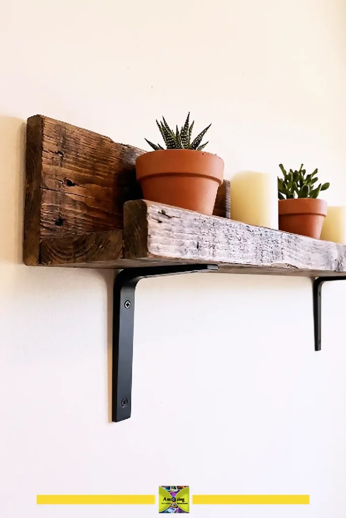 Rustic pallet wall shelf with a front lip holding books and small decor on a painted wall