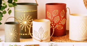 Coordinated set of upcycled tin can crafts — a wrapped planter, painted desk organizer, and punched lantern in sage, cream, and terracotta, with one clean empty food can.