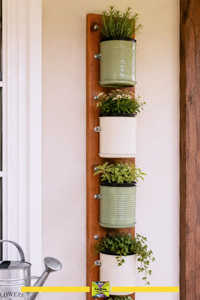 Vertical wall of small tin can planters holding herbs and succulents
