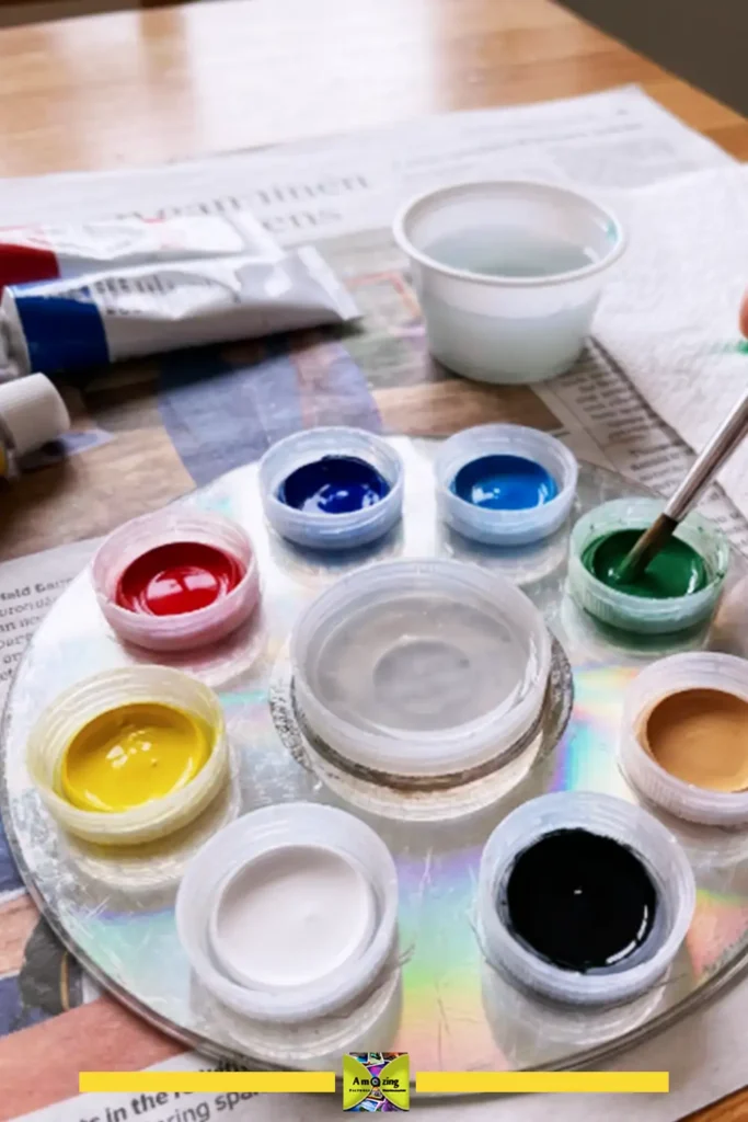 Mini paint palette made from plastic bottle caps holding small amounts of paint