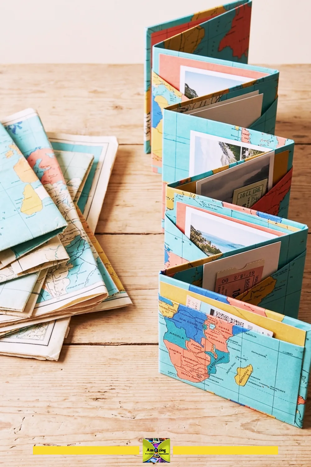 Folded map sheets beside an accordion folio holding photos and paper mementos.