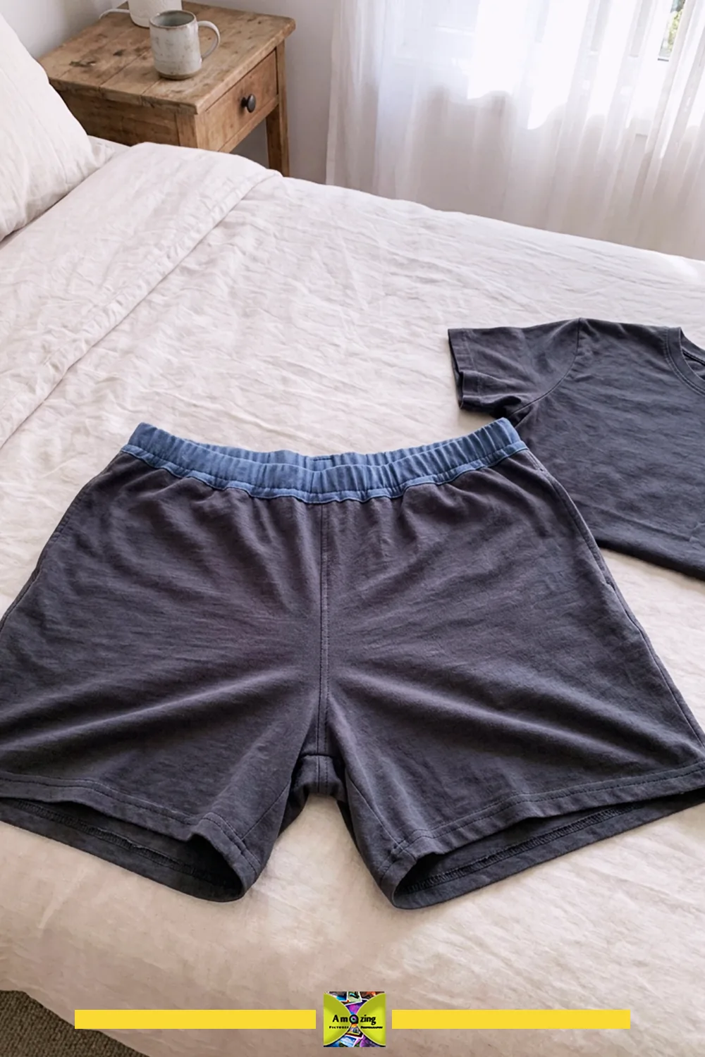 Handmade lounge shorts and matching t-shirt made from upcycled fabric displayed on a bed.