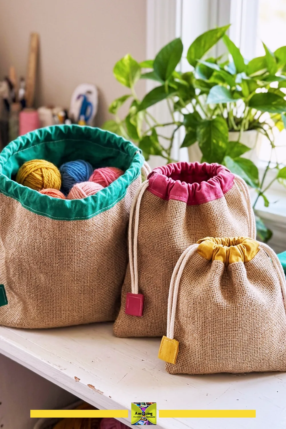 Three burlap drawstring sacks with colorful fabric tops arranged on a white shelf near a window.