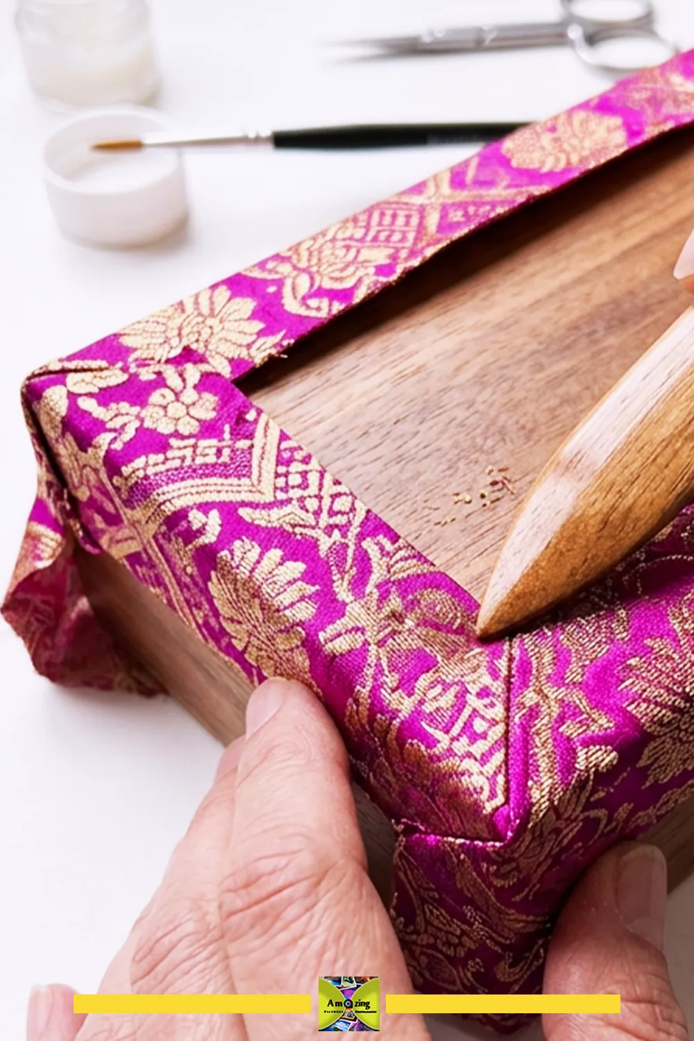 Clean folded corners on a necktie fabric-covered keepsake box before the adhesive cures