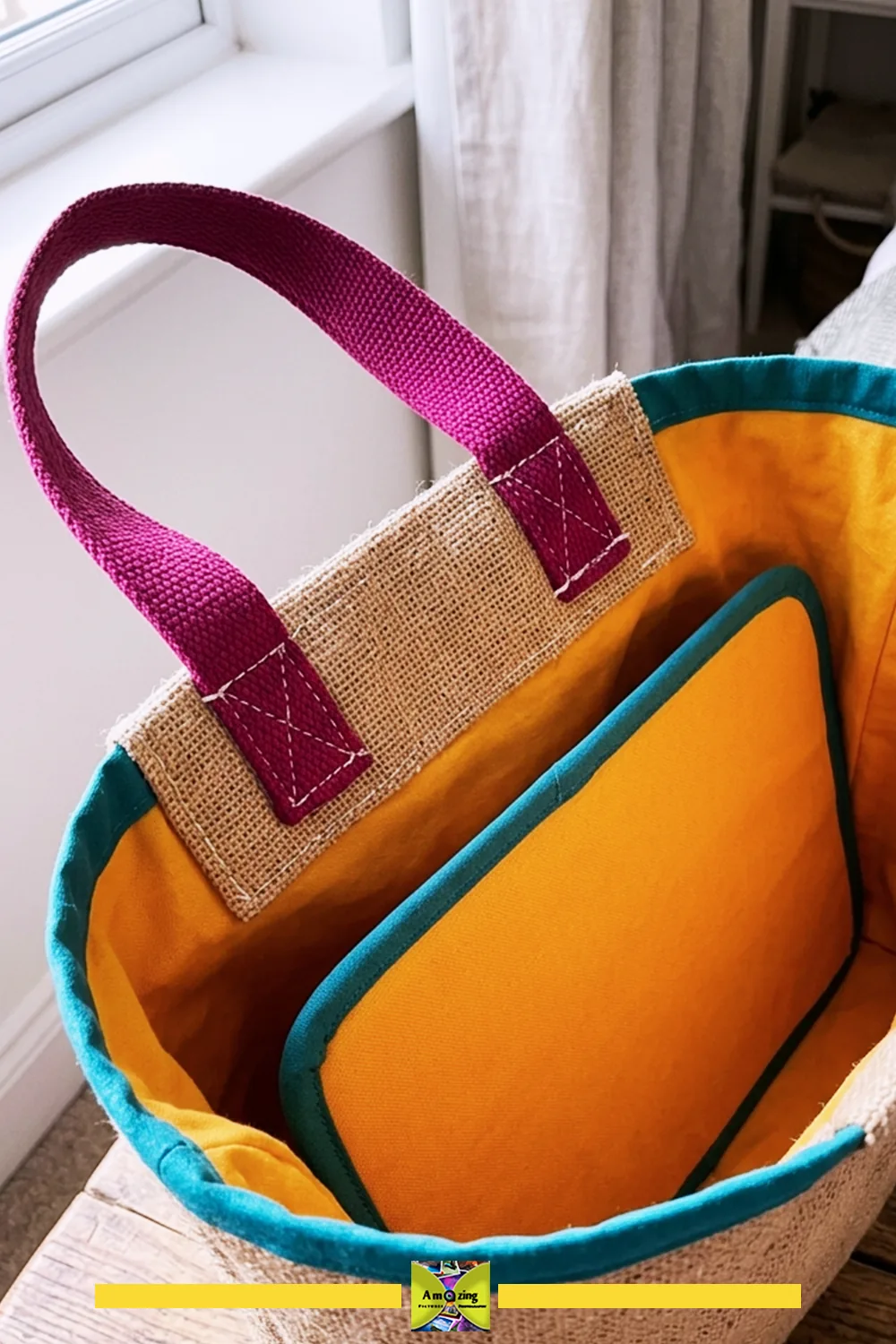 Open fabric gift bag with burlap top, magenta handle, and removable yellow base insert.