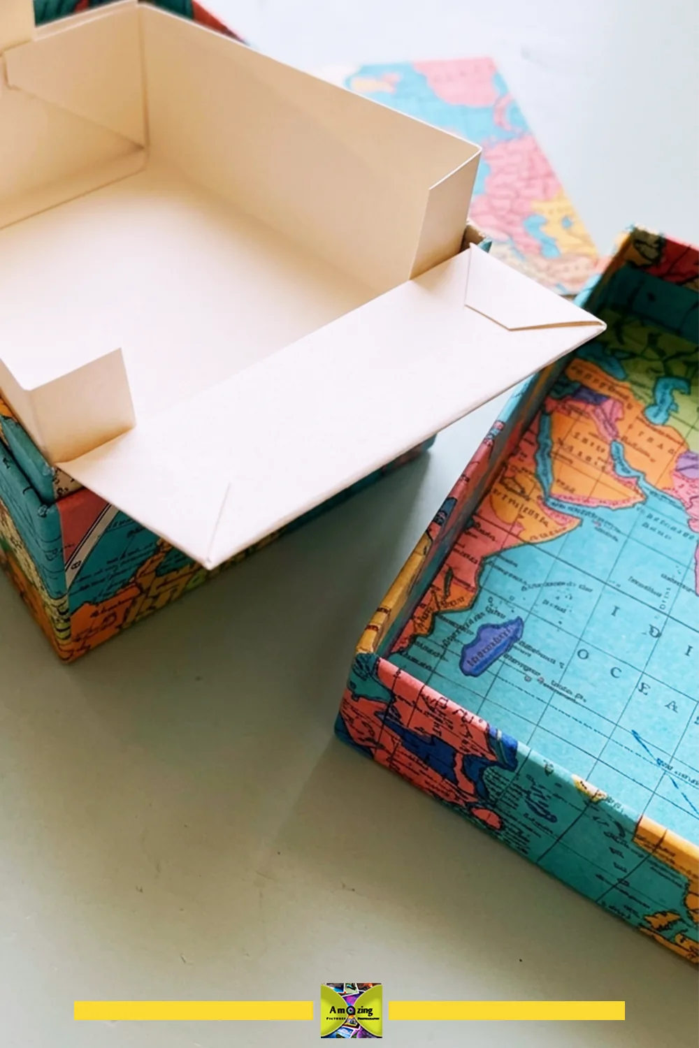 Open map-covered index-card box with a separate white paper liner.