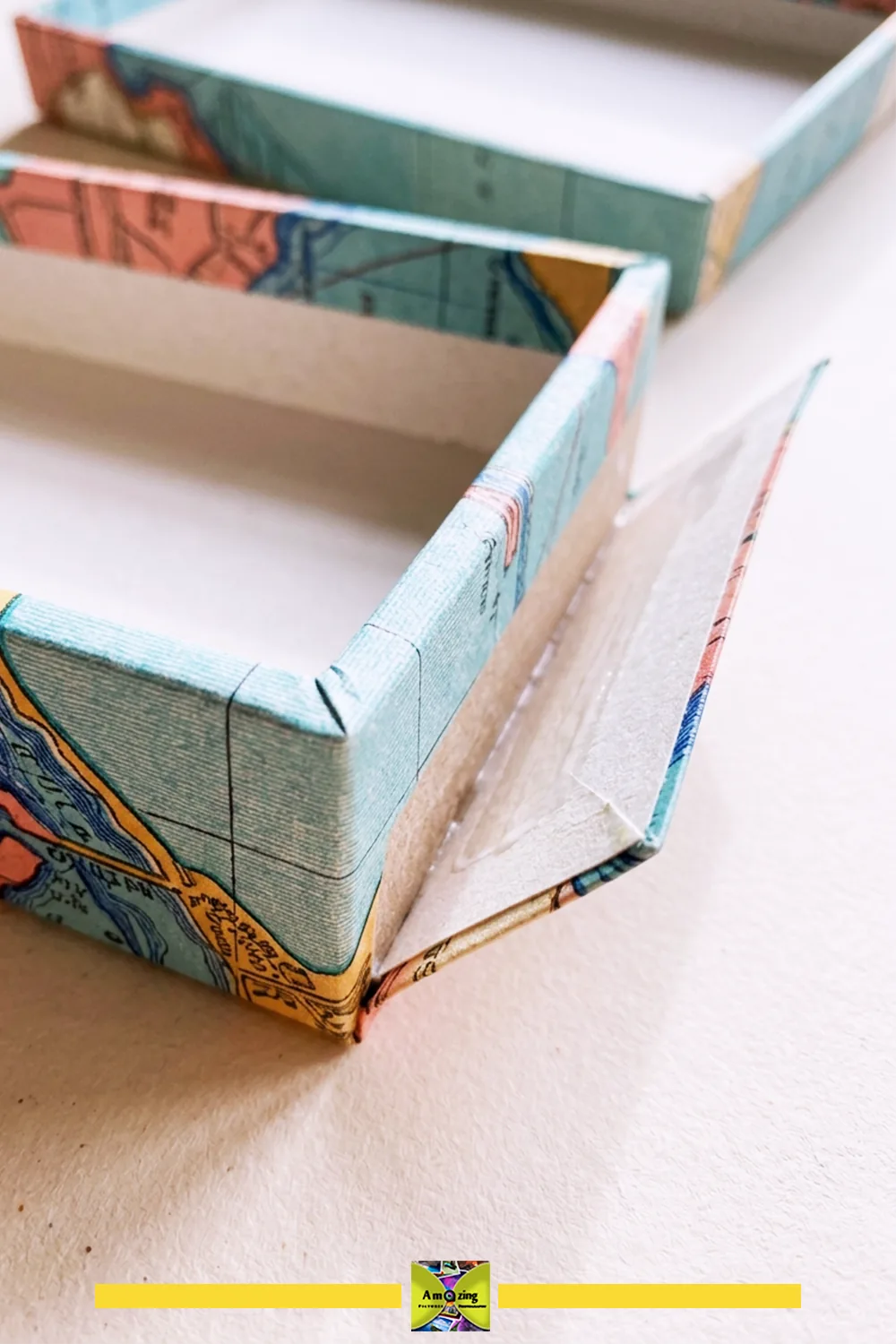 Close-up of map paper wrapped around the corner of a keepsake box.