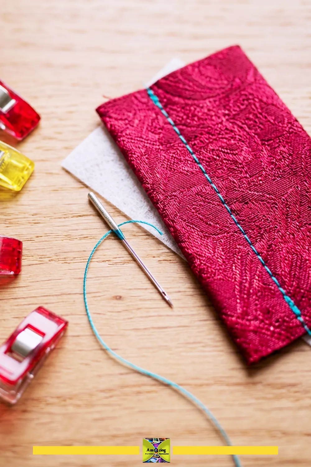 Needle, thread, stabilizer sample, and a test seam on a matching necktie offcut