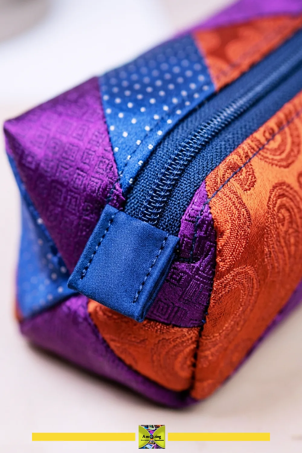 Close-up of reinforced zipper ends and the turned corner on a slim lined necktie zipper pouch