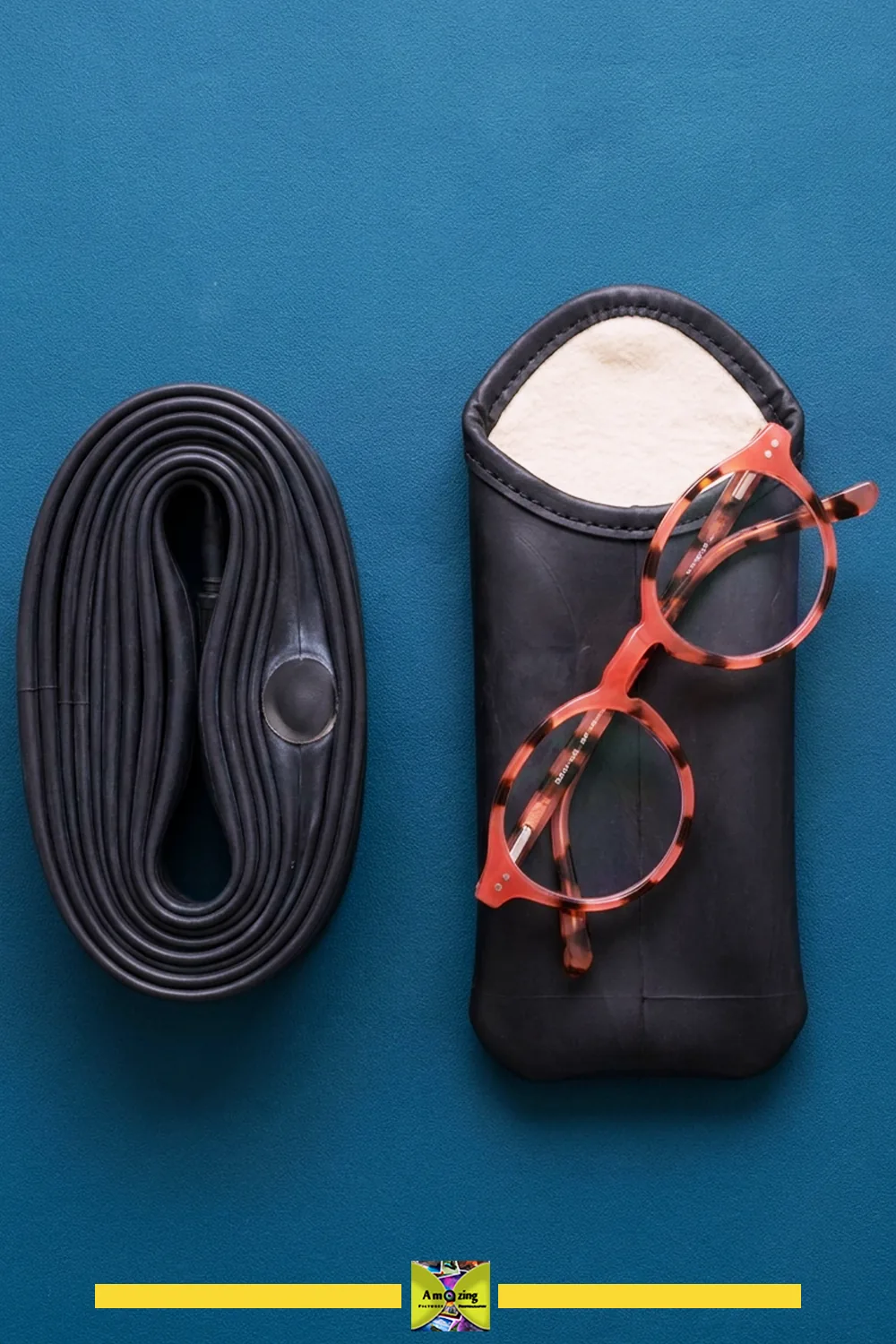 Retired black bicycle inner tube shown beside the finished lined eyeglass sleeve