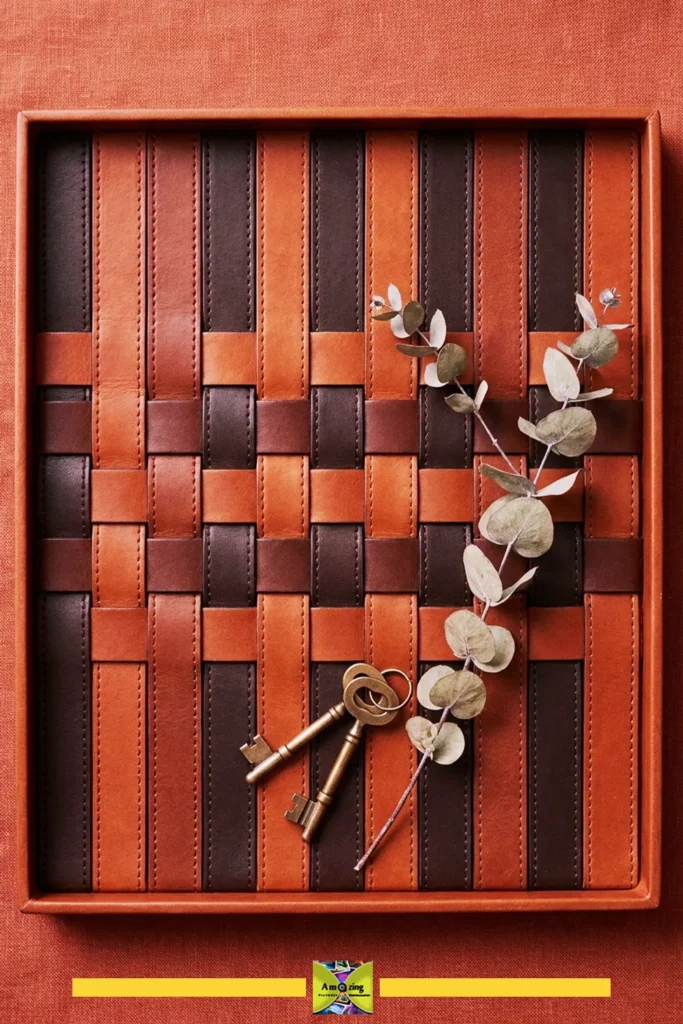Woven leather belt inlay tray with two vintage keys and a eucalyptus branch on top