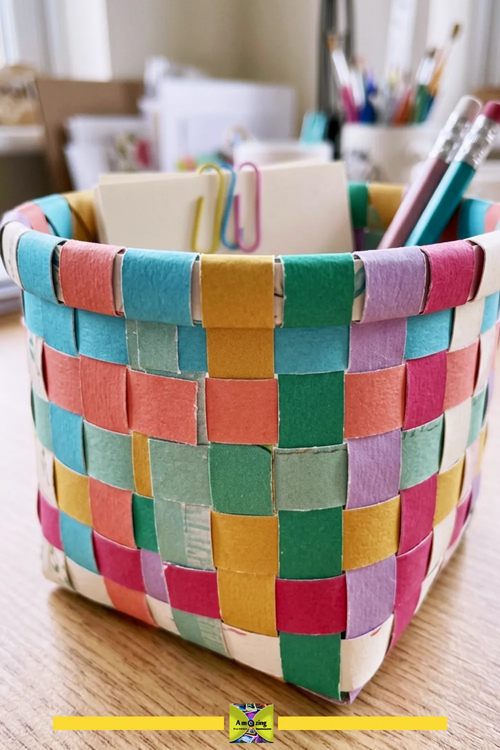 Small woven desktop basket made from greeting-card strips