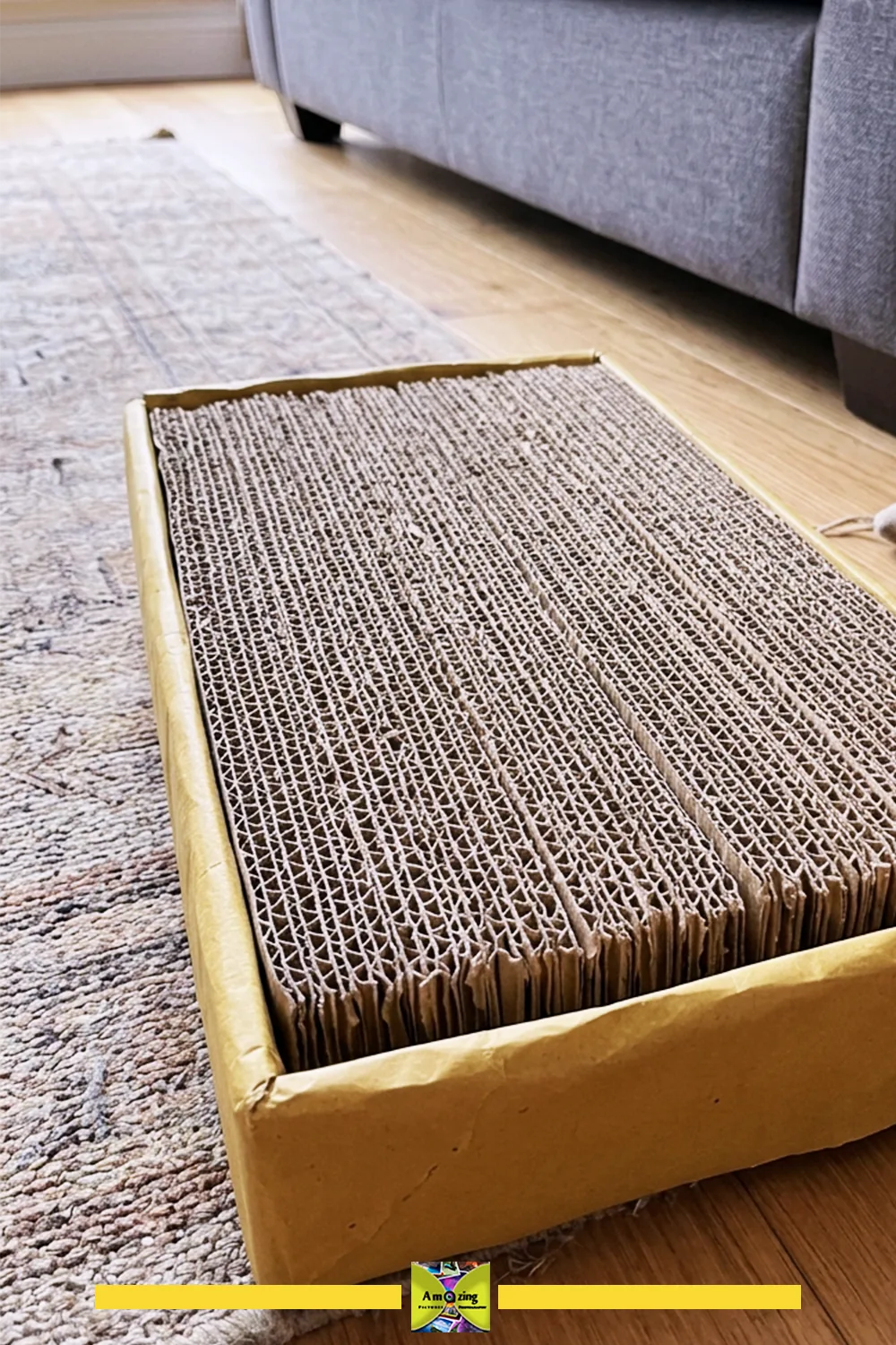 DIY cat scratcher made from strips of layered corrugated cardboard packed inside a rectangular box, on a rug