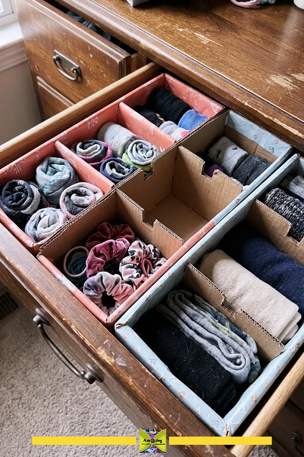 Open dresser drawer organized with DIY cardboard dividers separating socks and hair accessories