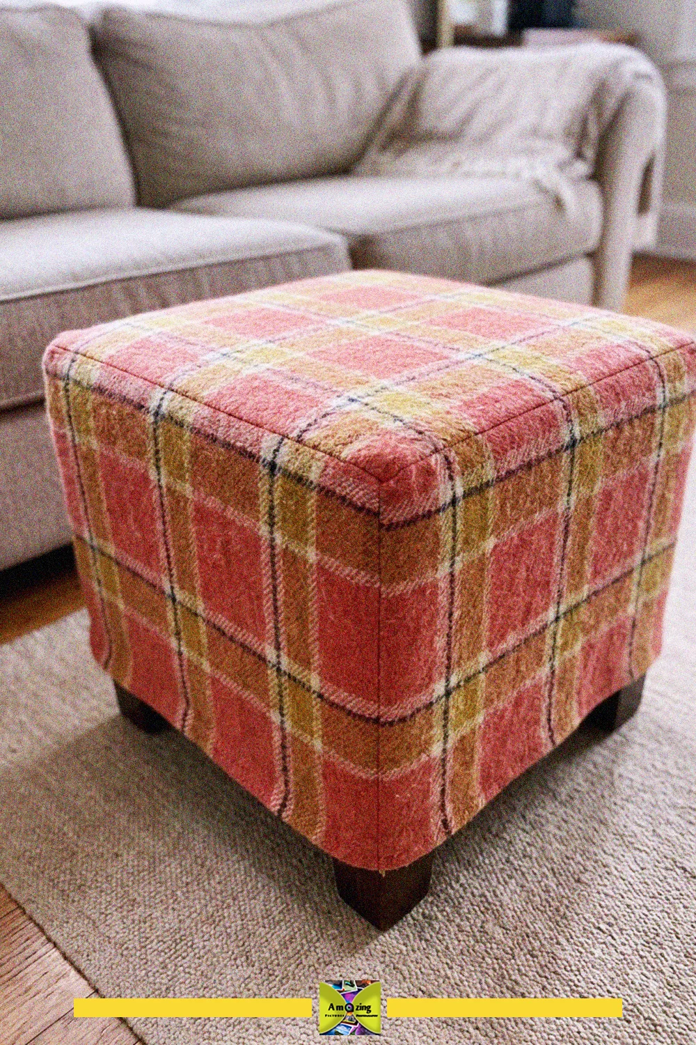 Plaid recycled blanket fitted as a cover over a square ottoman in a living room